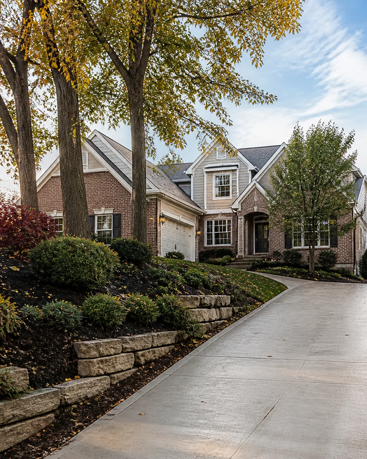 Clean driveway and landscaped yard at a Dublin, Ohio home after property cleanup