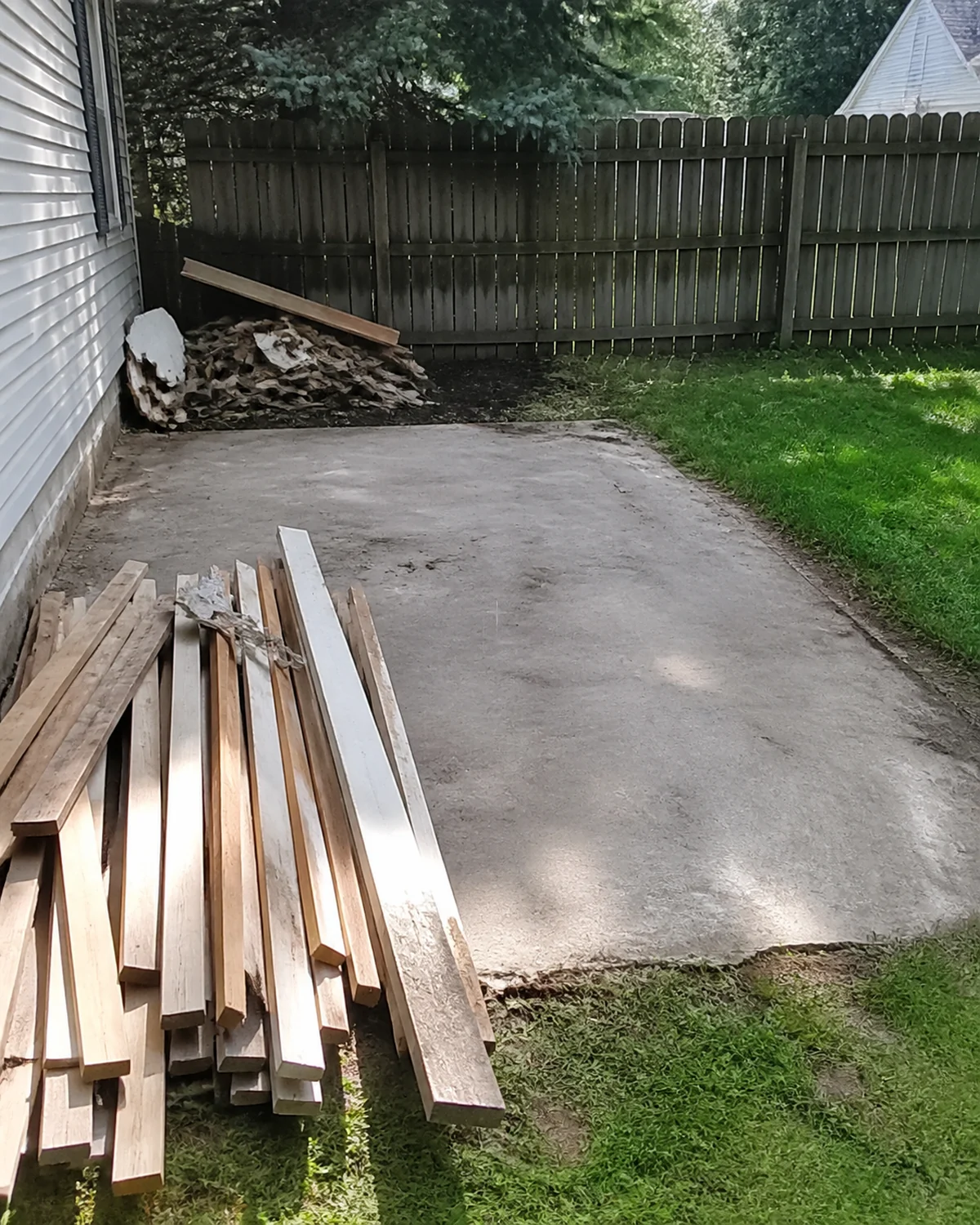 Sorted demolition debris and a clean work area at a central Ohio property